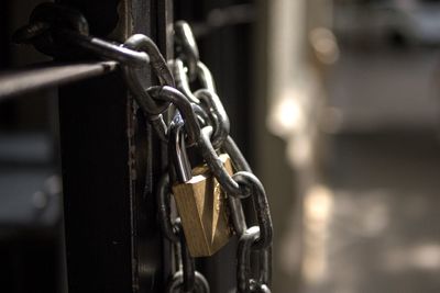 Close-up of chain hanging on metal