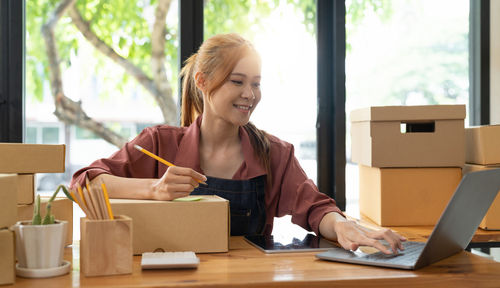 Young woman working at office