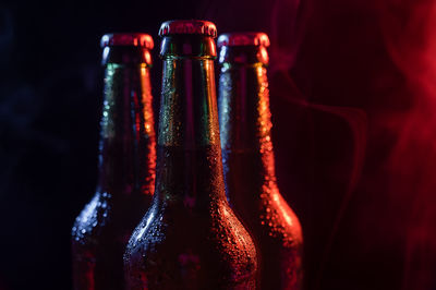 Close-up of wine bottles on table