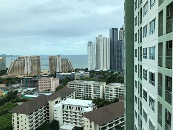 Buildings in city against sky