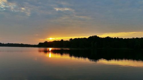 Scenic view of lake at sunset