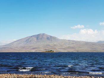 Scenic view of sea against cloudy sky