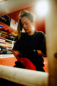 Young woman sitting at home