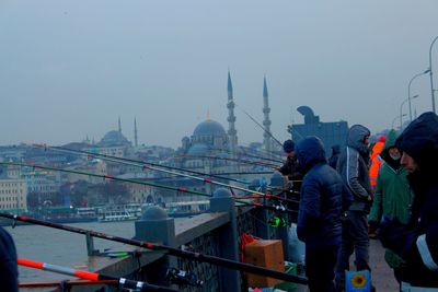 People looking at view of buildings in city