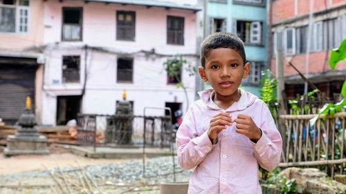 Portrait of cute girl standing outdoors