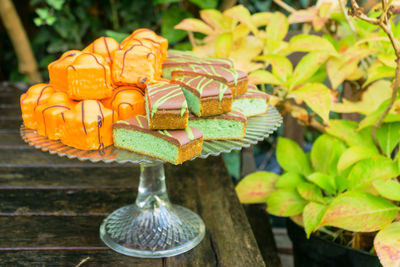 Close-up of dessert on cakestand at table