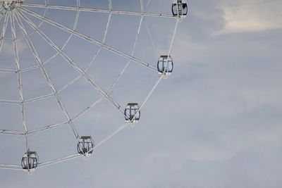 Low angle view of ferris wheel against sky