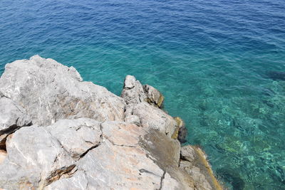 High angle view of rock formation in sea