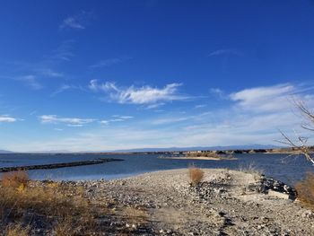 Scenic view of landscape against blue sky