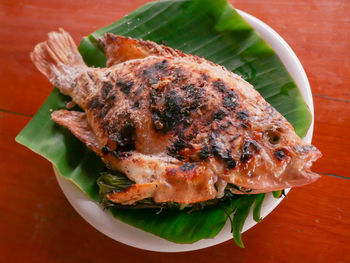 High angle view of fish in plate on table