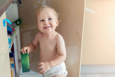 High angle view of baby boy standing at home