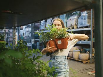 Woman holding flower pot
