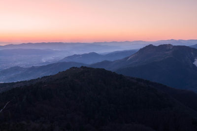 Scenic view of mountains against sky during sunset