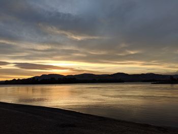 Scenic view of lake against sky during sunset