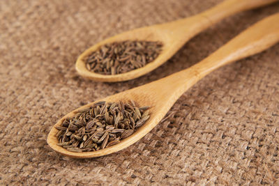 Close-up of ingredient in wooden spoon on table