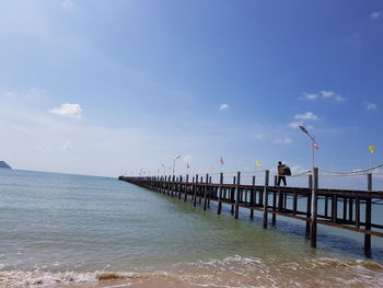 Pier on sea against sky