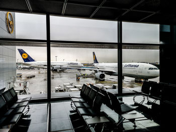 Airplane seen through glass window