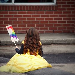 Rear view of woman with umbrella