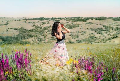 Young woman in wildflowers