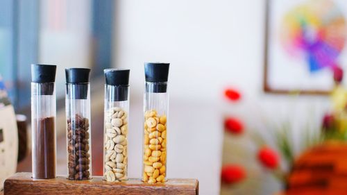 Close-up of coffee beans in containers