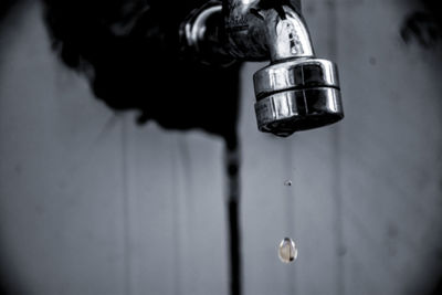 Close-up of water falling from faucet