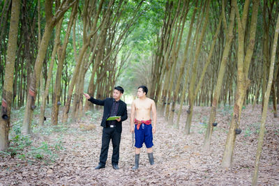 Full length of a young woman in forest