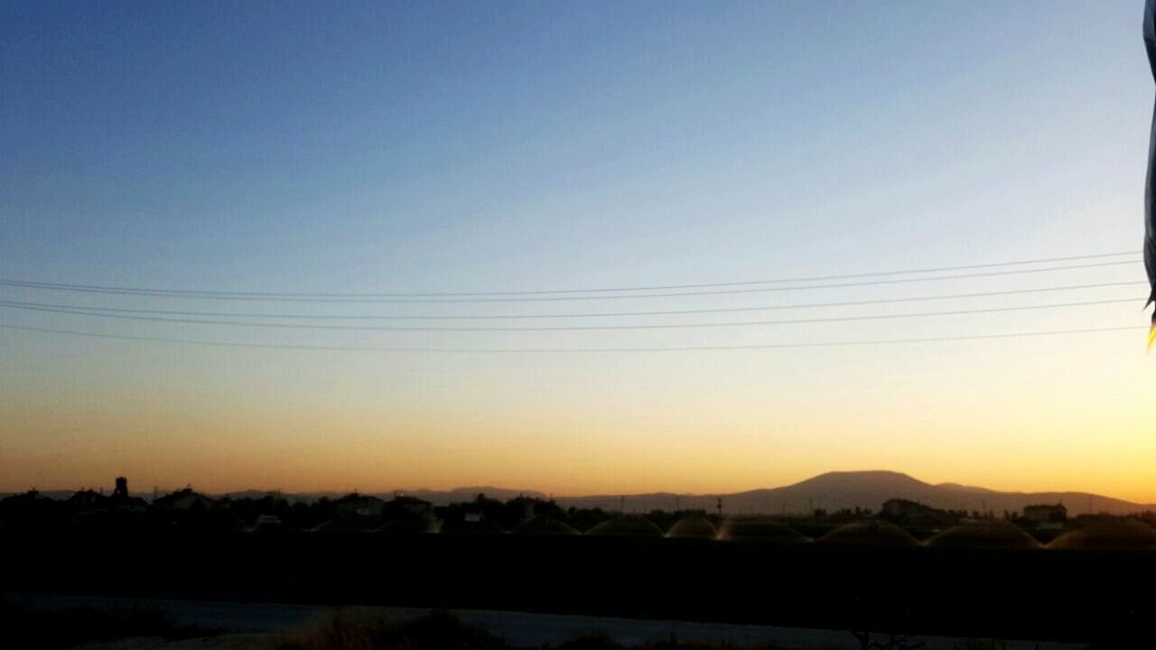 SILHOUETTE LANDSCAPE AGAINST CLEAR SKY