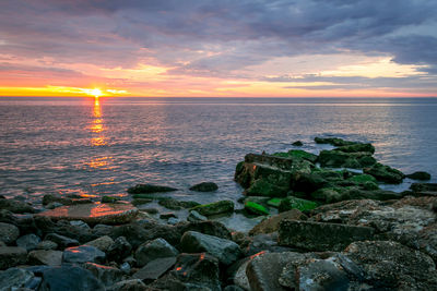 Scenic view of sea against sky during sunset