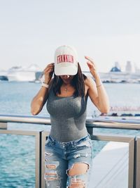 Woman standing on yacht in sea