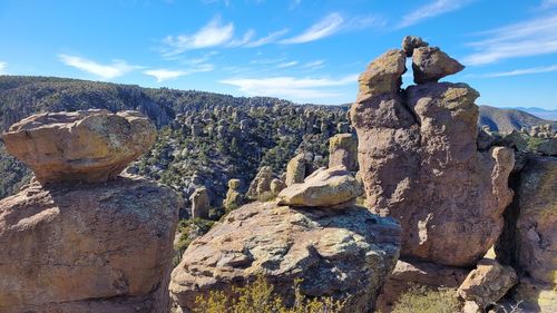 Rock formations on mountain against sky