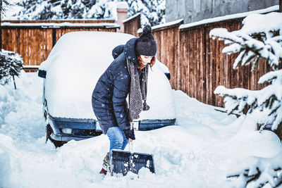 Woman on snow covered field