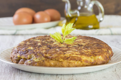 Close-up of omelet served in plate on table