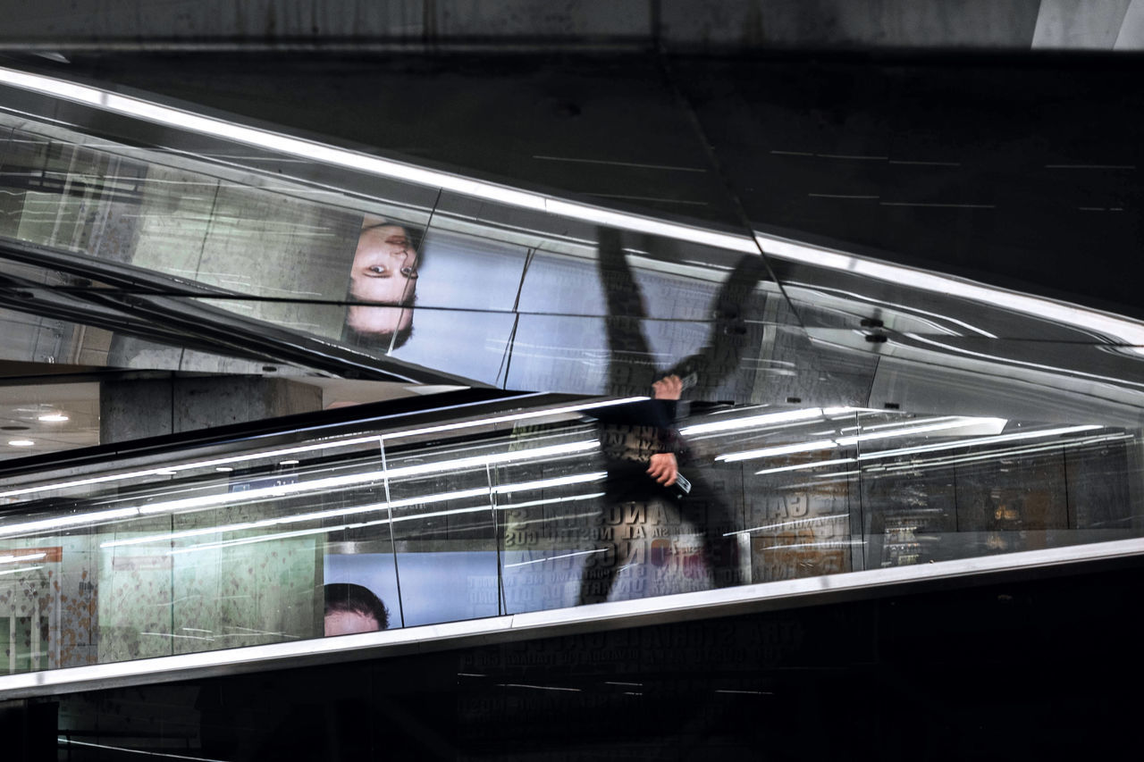 transportation, architecture, motion, blurred motion, on the move, mode of transportation, escalator, city, men, public transportation, group of people, travel, real people, rail transportation, railroad station, indoors, walking, women, adult, incidental people, modern, moving walkway