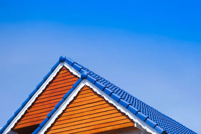 Low angle view of building against clear blue sky