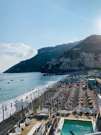 High angle view of harbor and city against sky