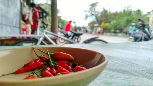 Close-up of red chili peppers in bowl on table