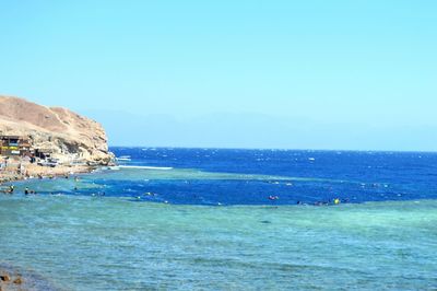 Scenic view of sea against blue sky