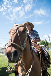 South american man riding horse