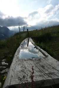 Scenic view of landscape against cloudy sky