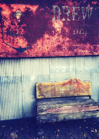 Close-up of rusty metal on wood