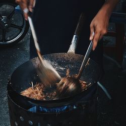 Midsection of man preparing food