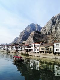 Scenic view of buildings and mountains against sky