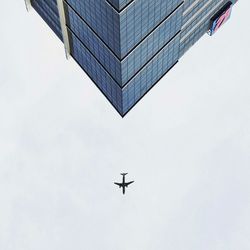 Low angle view of skyscraper against clear sky