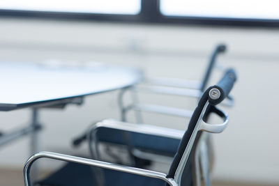 Close-up of office chair  equipment on table