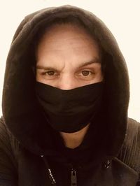 Close-up portrait of mid adult man over white background