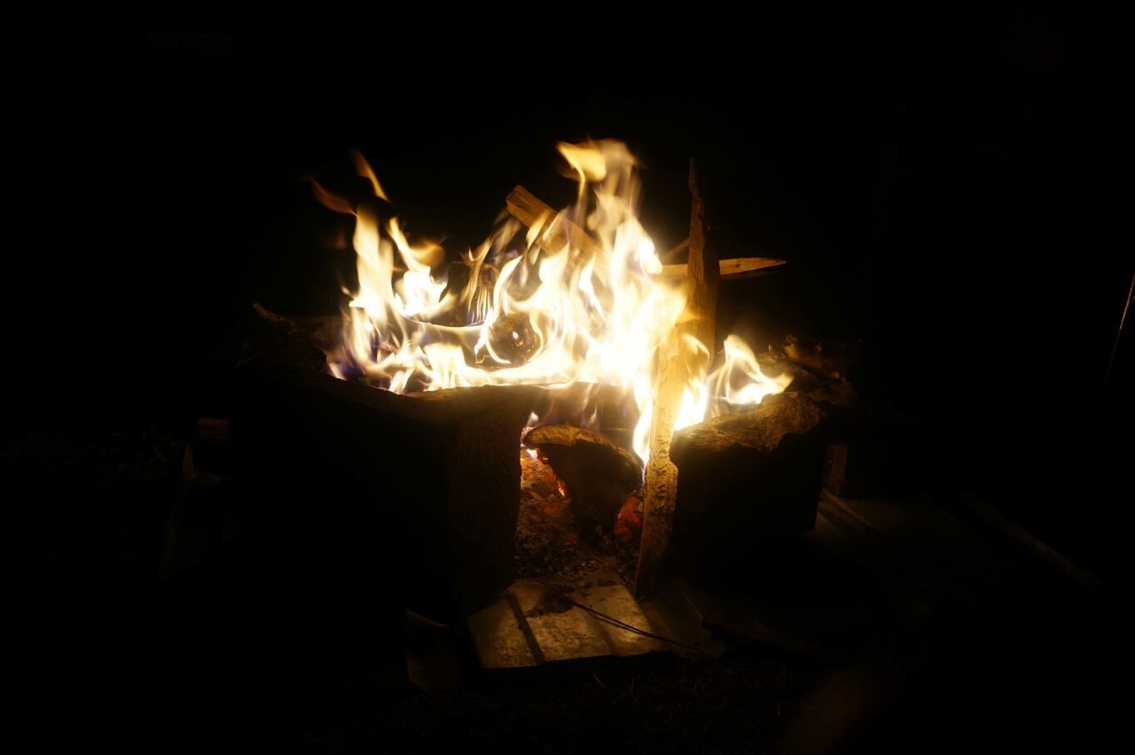 flame, burning, fire - natural phenomenon, heat - temperature, night, glowing, bonfire, firewood, fire, dark, campfire, heat, motion, wood - material, close-up, illuminated, orange color, no people, fireplace, light - natural phenomenon