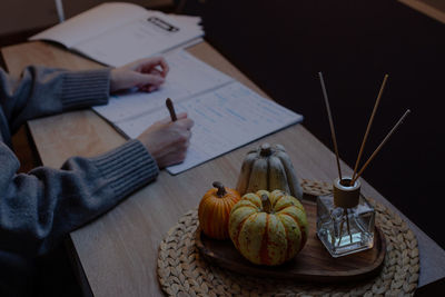 Cropped hand of man holding food on table