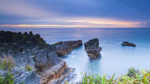 Scenic view of sea against sky during sunset pancake rocks