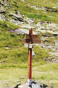 Close-up of cross on field