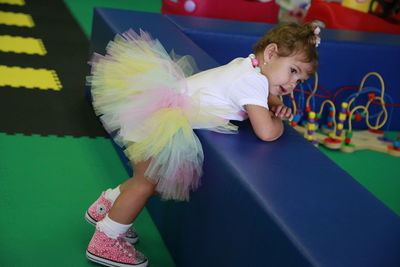 Side view of baby playing on shopping mall